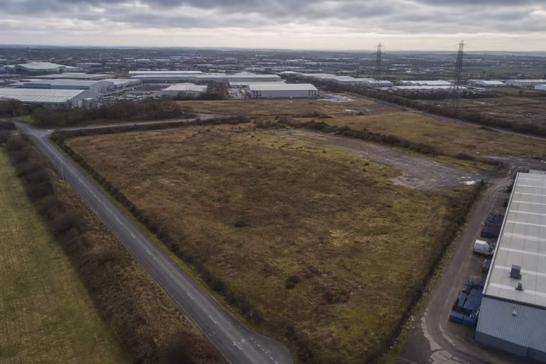 Strategic surplus land beside an industrial estate and electricity corridor